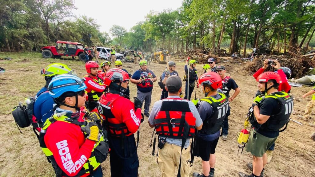 Firefighters from Mexico assist in recovery efforts on the Guadalupe River in Texas on July 10. Their training on the Rio Grande, known for its hazardous conditions, helped prepare them.